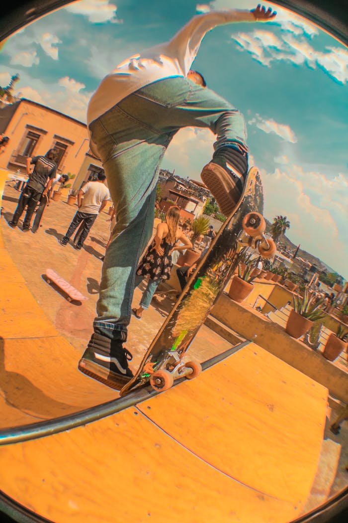 Thrilling fisheye view of a skateboarder performing tricks in vibrant San Miguel de Allende.